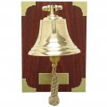 Brass bell on wooden plate with engraving plate and engraving